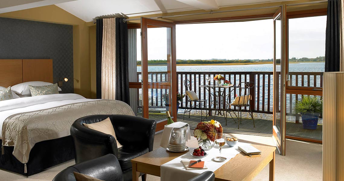 Lakeside luxury bedroom at Wineport Lodge.