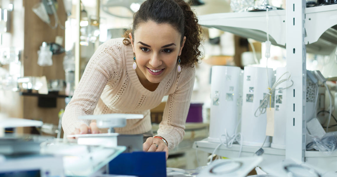 Woman browsing products at Allen's of Athlone.