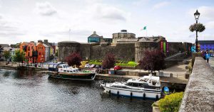 A boat passing Athlone Castle.