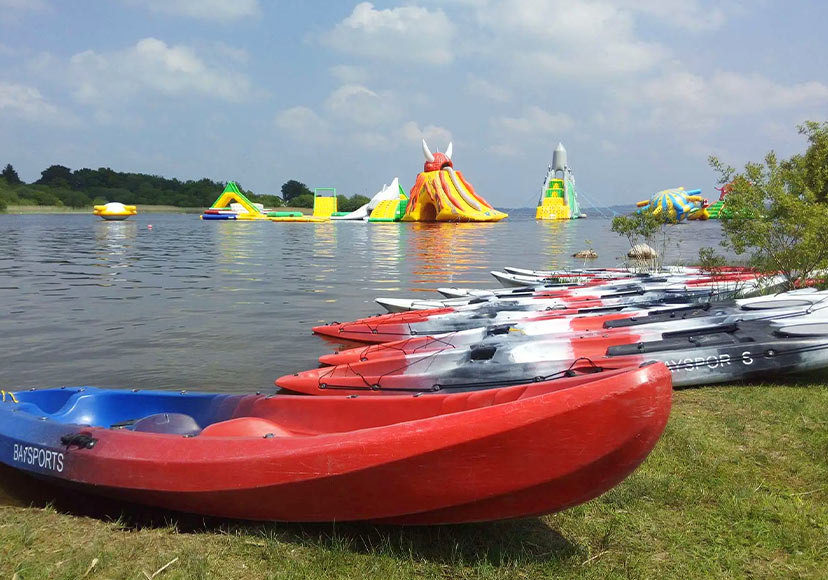 Kayaks on shore at Baysports.