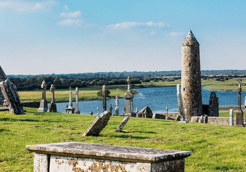 Round tower by the river at Clonmacnoise.
