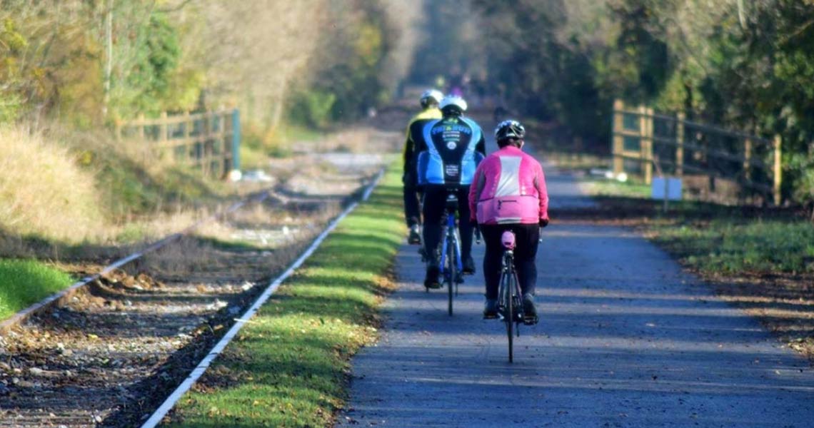 Cyclists on The Old Rail Trail Greenway.