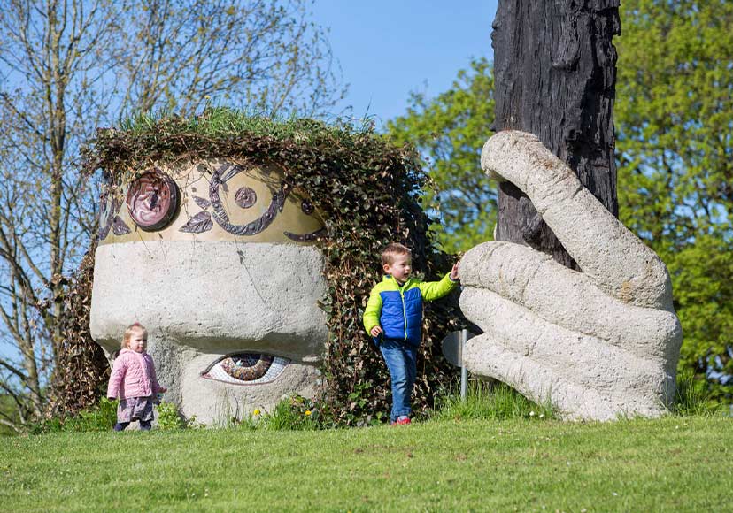 Two young children beside Lugh's Spear.. After-School Activities in Athlone, autumn walks