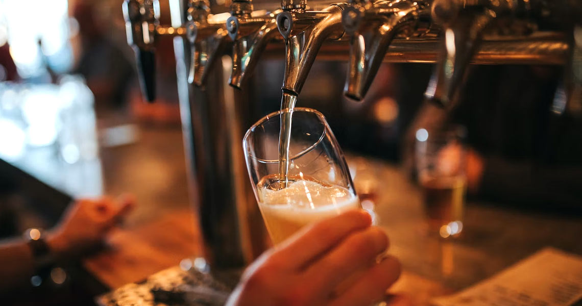 Bartender pouring a pint at Gertie Brownes Bar & Bistro.