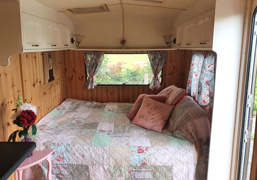 Small caravan bedroom at Glasson Glamping Farm.