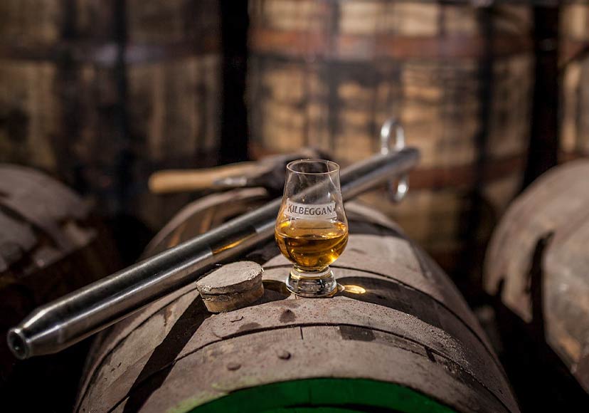 A glass of Kilbeggan whiskey on a barrel at the Distillery.