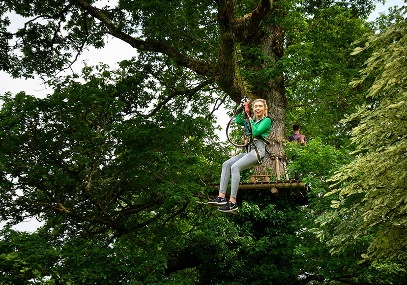 Woman on zipline at Lough Key Forest Park.