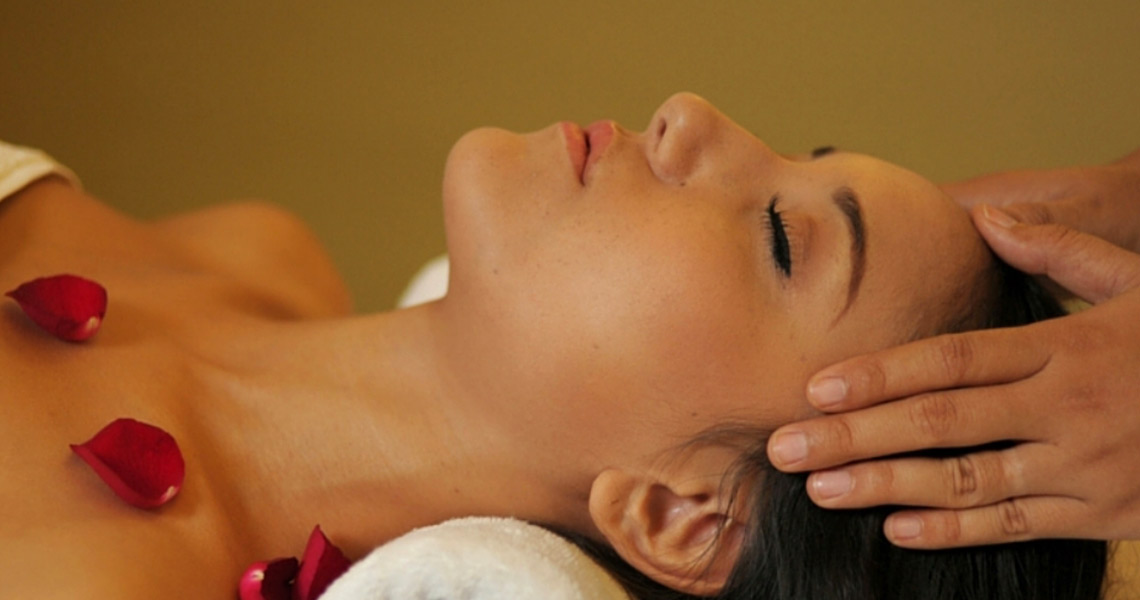 Woman receiving head massage at the Mingala Day Spa.